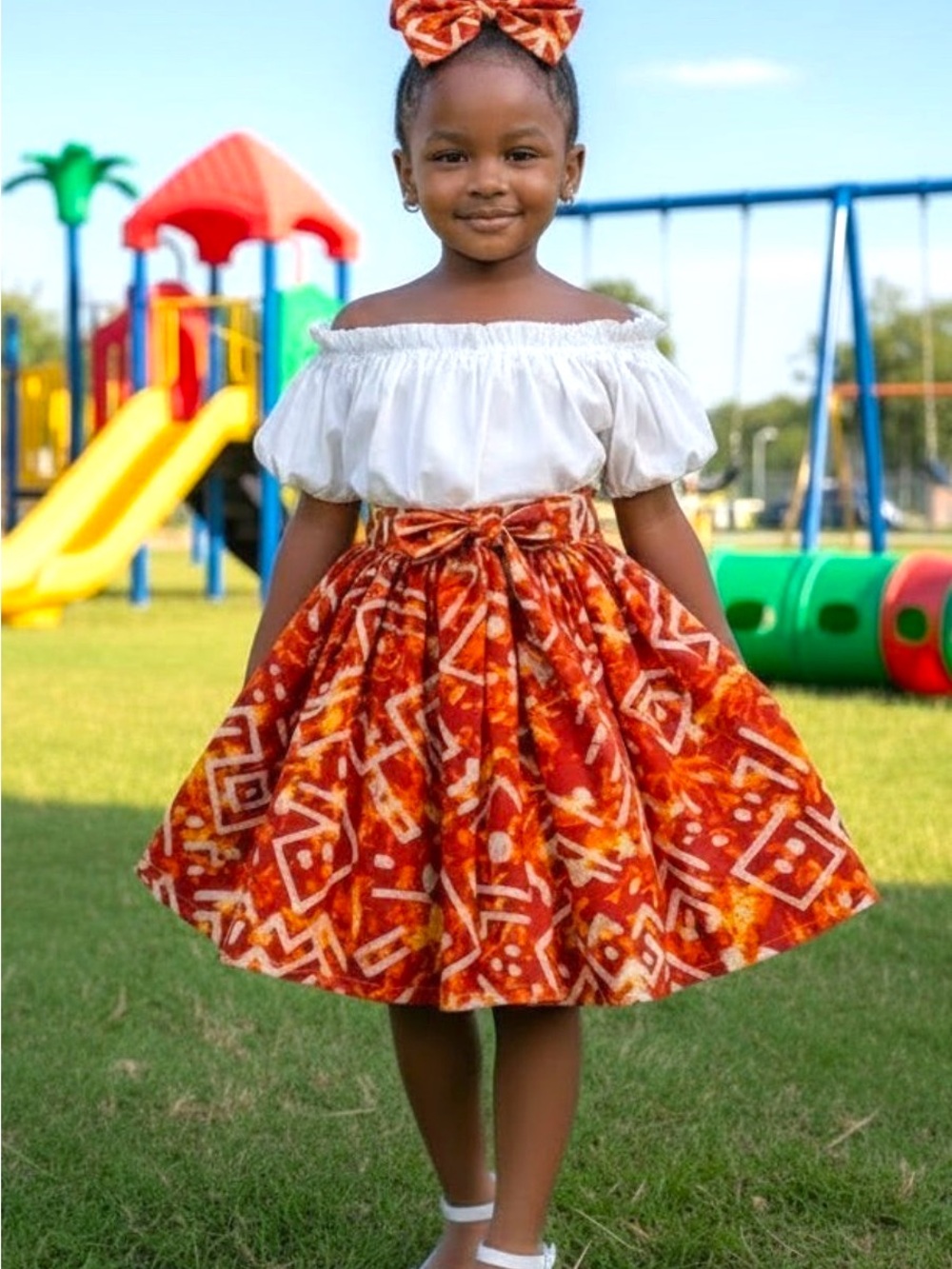 Girls Orange Patterned Skirt with Bow Waistband -